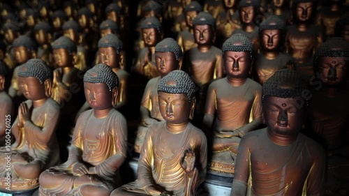 Multiple Buddha statues in Seokbulsa Mountain temple in Busan, South Korea photo