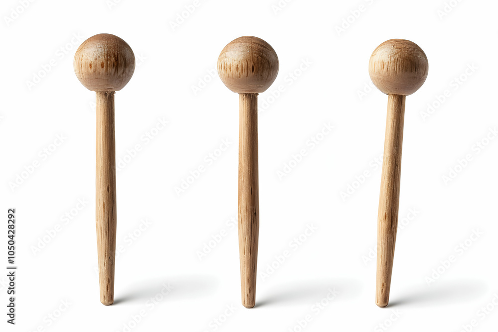 Three wooden skewers with round tips isolated on a white background. Three wooden skewers with round tips isolated on a white background.