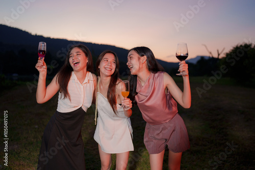 Asian women celebrating, meeting and chatting in a bar. Places to visit, beautiful lights