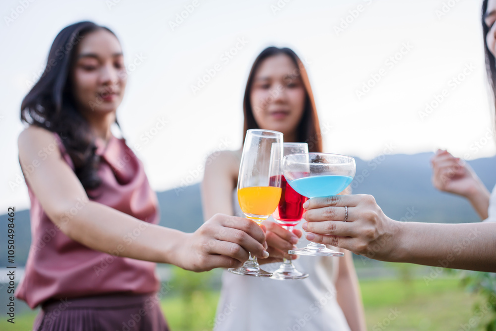 Asian women celebrating, meeting and chatting in a bar. Places to visit, beautiful lights