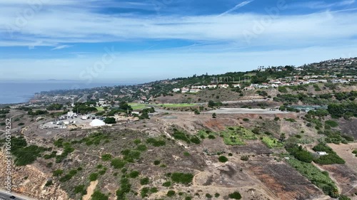Aerial Flying From Ocean into Hills of Palos Verdes, California with Ocean in Background