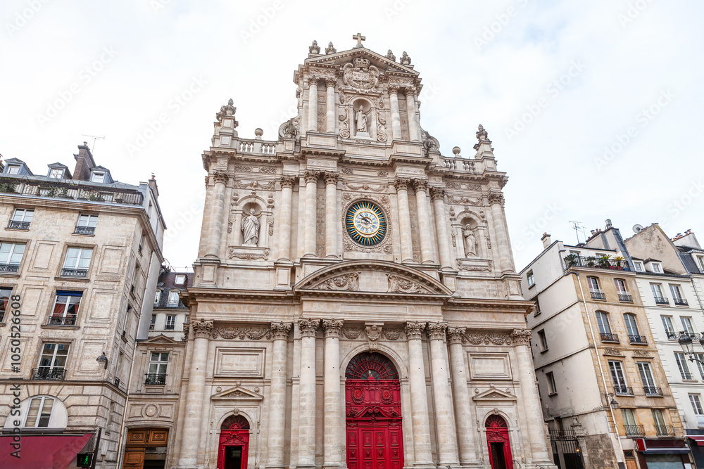 Eglise Saint Paul Saint Louis in Paris is a stunning example of Baroque architecture. Cathedral Facade intricate stonework, paired with elegant sculptures