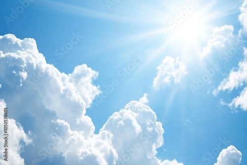 A bright and sunny day with clouds and sun visible