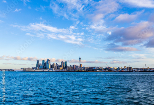 Cityscape panoramic view of Sky Tower and CBD waterfront from Bayswater Marina