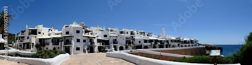 Panoramic view of Binibeca or Binibequer Vell. Urbanization on the island of Menorca, imitating the white houses of fishermen. Balearic Islands