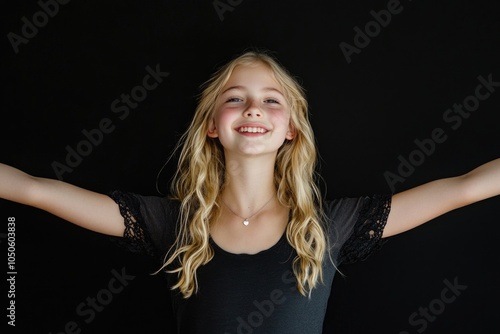 Young girl spreading her arms wide open photo