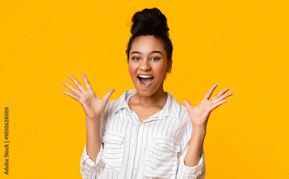 Surprised Black Girl Screaming With Excitement, Looking At Camera Holding Hands Near Face, Standing Over Yellow Background In Studio, Free Space Surprised Black Girl Screaming With Excitement, Looking At Camera Holding Hands Near Face, Standing Over Yellow Background In Studio, Free Space