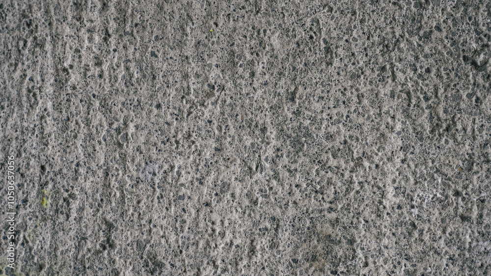 Close-up of rough gray concrete texture. Detailed stone-like surface, ideal for backgrounds, industrial themes, or raw material design elements Close-up of rough gray concrete texture. Detailed stone-like surface, ideal for backgrounds, industrial themes, or raw material design elements