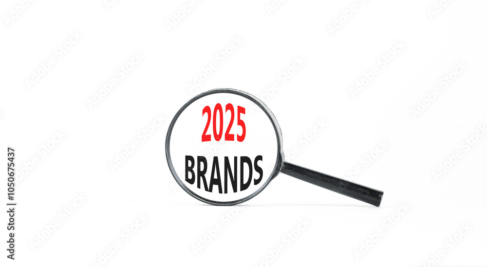 Planning 2025 brands new year symbol. Concept words 2025 Brands on beautiful white paper in magnifying glass. Beautiful white paper background. Business 2025 brands new year concept. Copy space. Planning 2025 brands new year symbol. Concept words 2025 Brands on beautiful white paper in magnifying glass. Beautiful white paper background. Business 2025 brands new year concept. Copy space.
