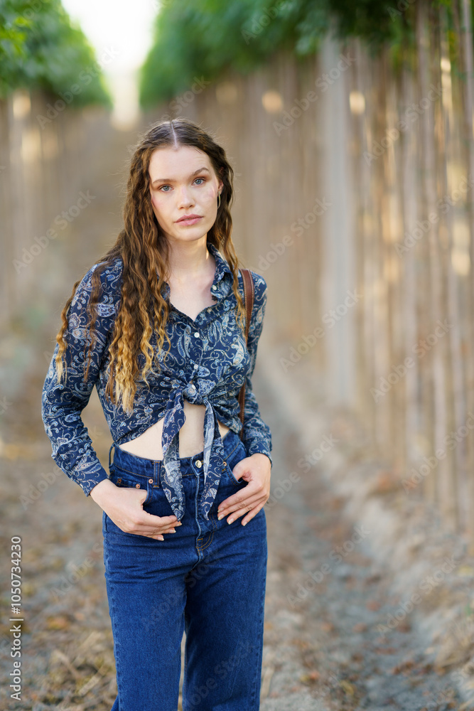 A Young Woman in Nature Displaying a Stylish Outfit Amidst the Beautiful Scenery A Young Woman in Nature Displaying a Stylish Outfit Amidst the Beautiful Scenery