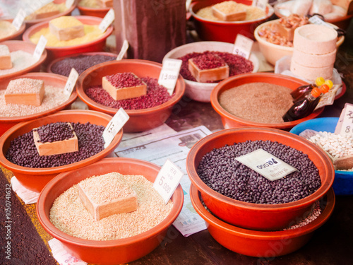 An assortment of grains in a market place photo