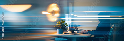 Silhouette of a person working on a laptop with a plant in a blue pot  in a modern office setting  conveying a sense of focus and productivity   