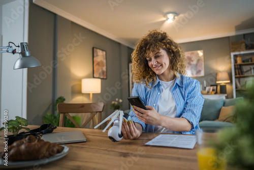 adult caucasian woman adjust prepare home surveillance security camera