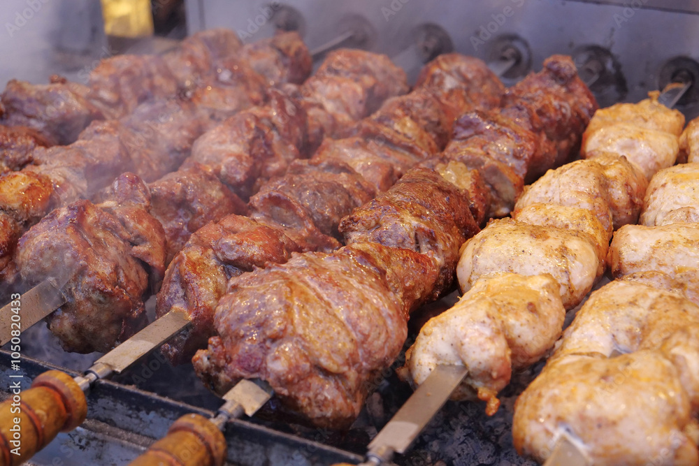 Kebabs on skewers are grilled on hot coals Kebabs on skewers are grilled on hot coals