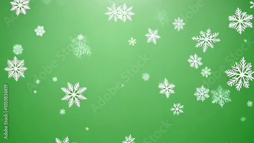 Small white snowflakes gently falling on a light green background in winter. video