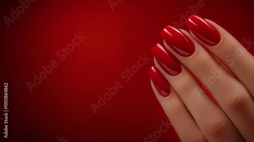 Brightly colored nail polishes arranged artistically on a vibrant pink backgr...