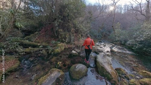 Awkward Rock Hopping Over Creek in Great Smoky Mountains National Park photo