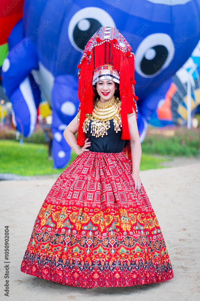 Beautiful portrait fashion of Akha hill tribe girls wearing traditional costumes happily relaxing in a lovely flower garden is a travel destination in autumn at Chiang Mai, Northern, Thailand. Beautiful portrait fashion of Akha hill tribe girls wearing traditional costumes happily relaxing in a lovely flower garden is a travel destination in autumn at Chiang Mai, Northern, Thailand.