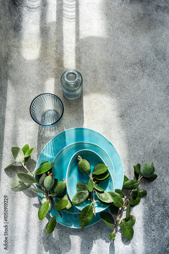 Top view of feijoa fruit arranged on a turquoise table setting photo