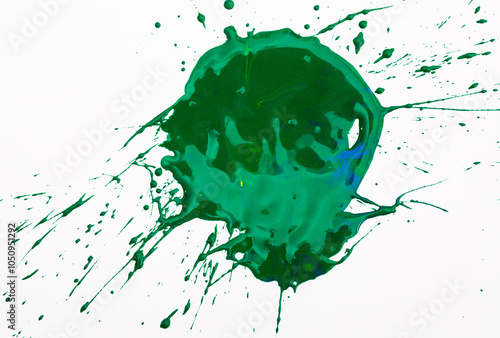 Spilled green paint spot on paper, colorfull artistic image on white background photo