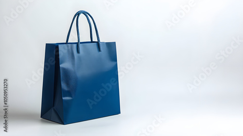 blue shopping bag stands elegantly on white background, perfect for showcasing products