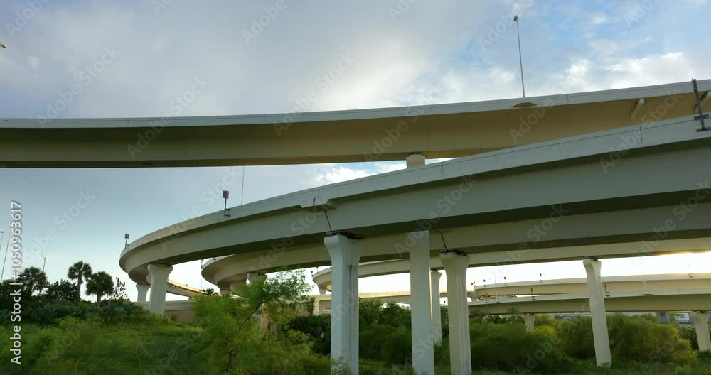 USA transportation infrastructure. American freeway intersection with fast driving cars and trucks in Tampa, Florida. USA transportation infrastructure. American freeway intersection with fast driving cars and trucks in Tampa, Florida.