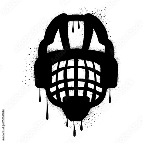 Hockey helmet with black spray paint graffiti