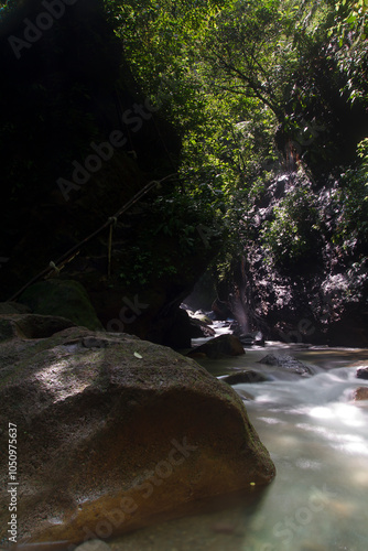 Bogor, Indonesian -January 07, 2024: The beauty of the Umbrella waterfall has become a holiday destination for the people of Bogor City, West Java photo