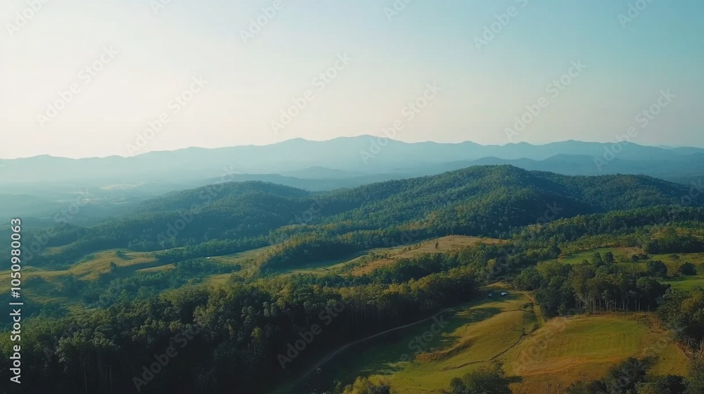 Fototapeta premium Serene Aerial View of Rolling Green Hills