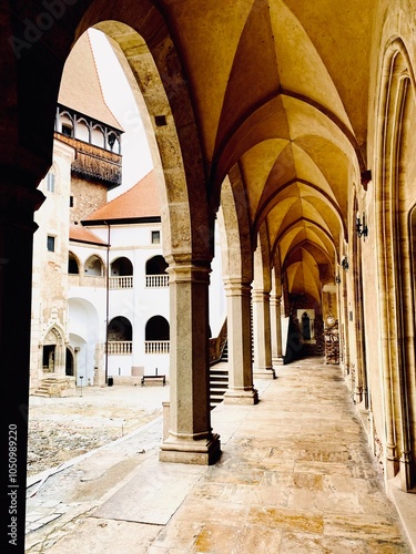 Colonnaded corridor in the Gothic style castle Corvinilor in Hunedoara, Romania. photo