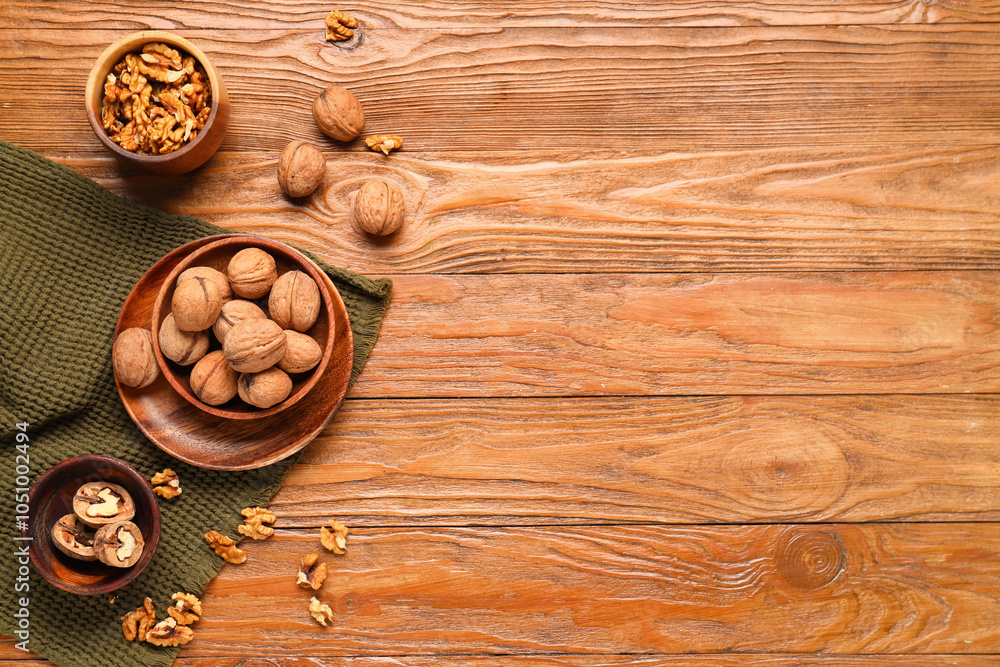 Bowls with walnuts on wooden background Bowls with walnuts on wooden background