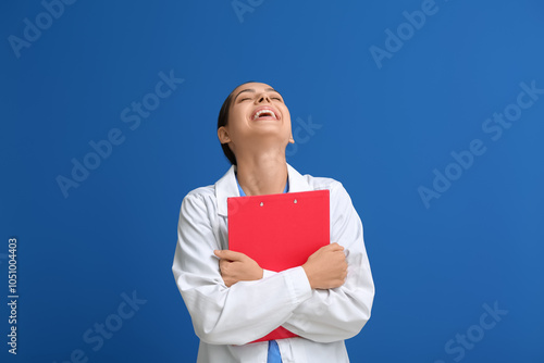 Happy female doctor laughin...