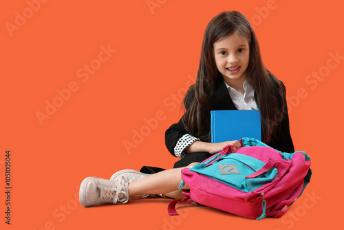 Cute little schoolgirl with...