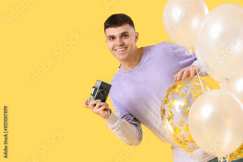 Young man with bunch of bal...