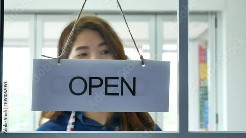 Woman hands turning sign board closed to open shop small local retail business. Happy Asian woman smiling face reopen shop again with service mind. Small owner turn sign plaboard welcome opening shop