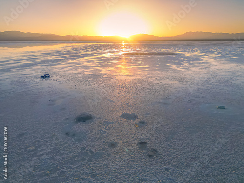 Sunset over Chaka salt lake taken from 300 meters above with a drone, Qinghai, China photo