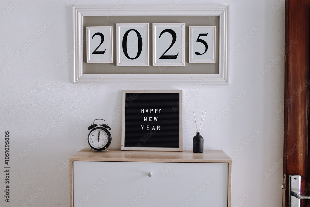 Happy New Year 2025 text on board and frame
