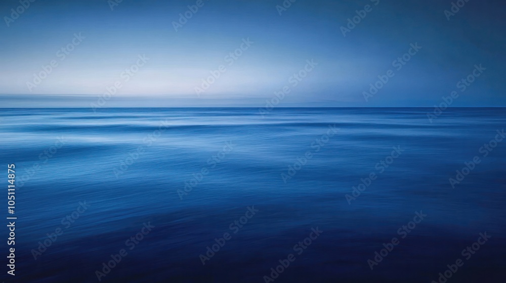 Fototapeta premium A serene landscape of the deep blue sea at twilight,