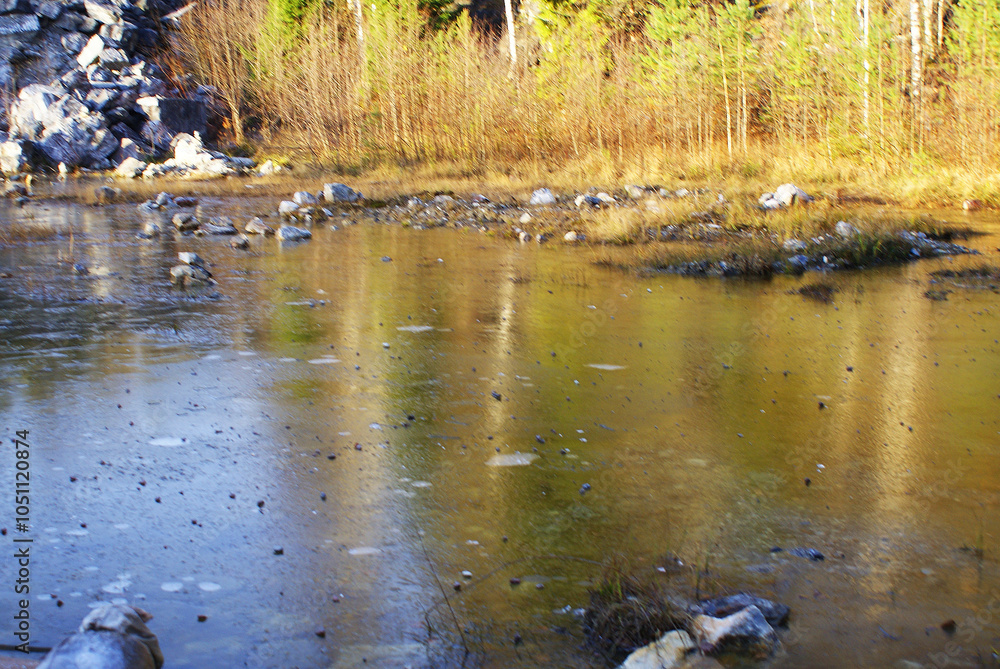 Fototapeta premium Beautiful view of lake in coniferous forest and rocky shore, wild nature, landscape.