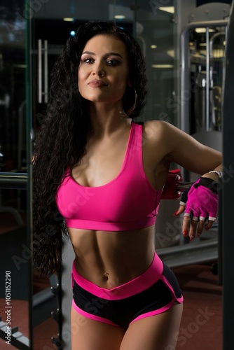 Gorgeous fitness model in a gym shot