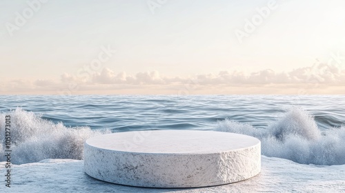 Hypersmooth pebble podium surrounded by gentle waves photo