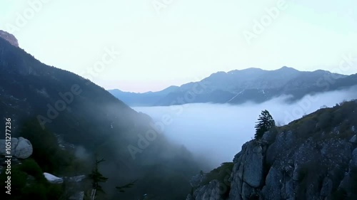 Subtle Fog Layer Rolling in Over a Rocky Mountain Landscape