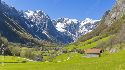 A picturesque village nestled in a valley surrounded by snow-capped mountains.