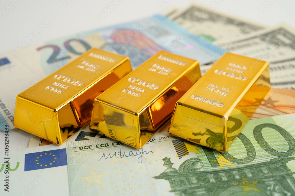 Gold bars with US dollar and Euro banknote money, finance trading investment business currency. Gold bars with US dollar and Euro banknote money, finance trading investment business currency.