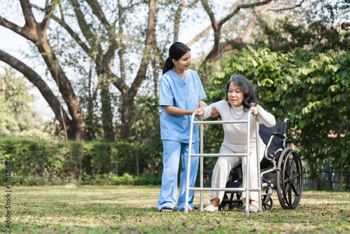 Elderly Woman in Rehabilitation with Caregiver Assistance Outdoors in a Park Setting photo