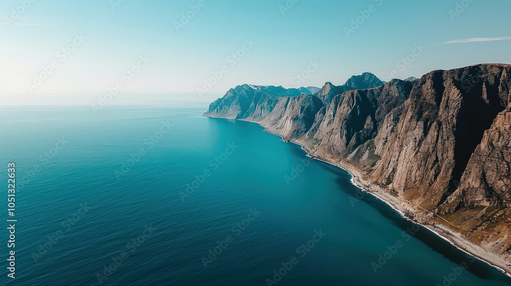 Obraz premium Aerial view of Lofotens deep fjords showcasing steep cliffs and tranquil waters. stunning landscape evokes sense of peace and natural beauty