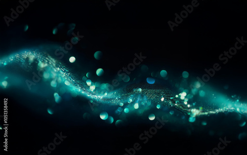 A swirling band of teal light and bokeh against a black background.