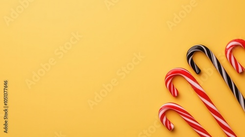 Red and black Christmas candy canes crossing over a goldlined background, festive and sweet holiday scene photo