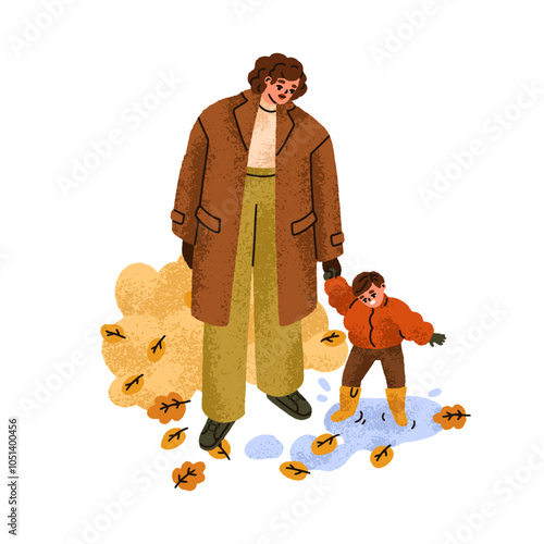 Kid jumping in puddle, walking with mother in autumn wet rainy weather. Happy...