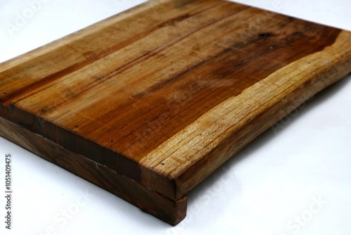 Square wooden cutting board isolated on white background with 45 degree angle setting